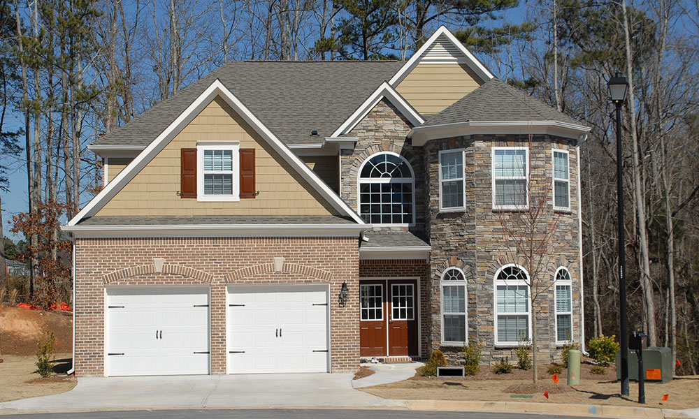 Double garage with single course brickwork