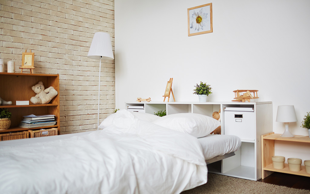 Kids bedroom with Brick texture and open storage