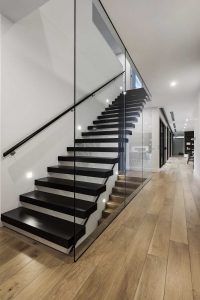 Designer glass staircase in the dark hues 